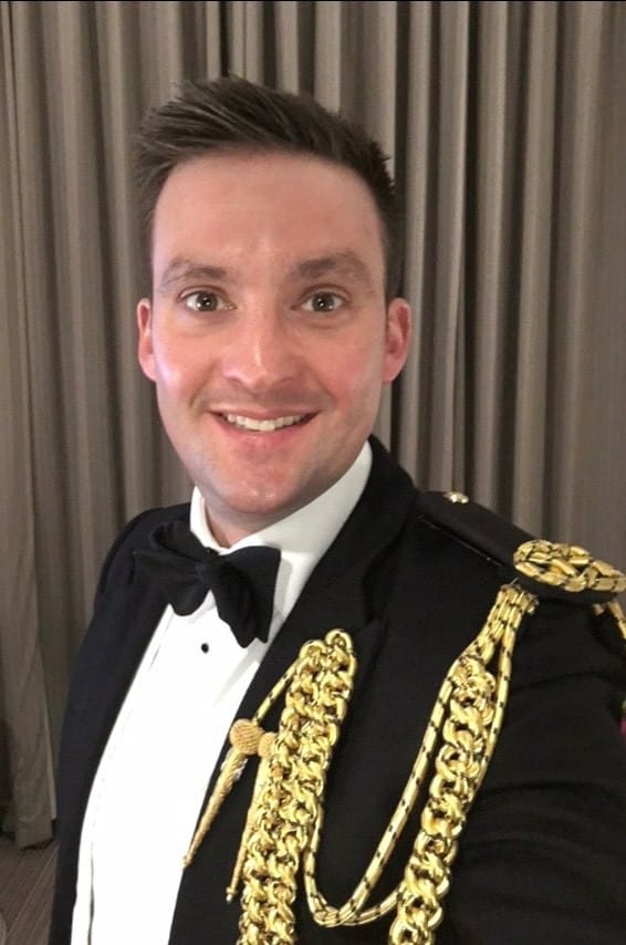 A photo of Richard Smith smiling in black tie