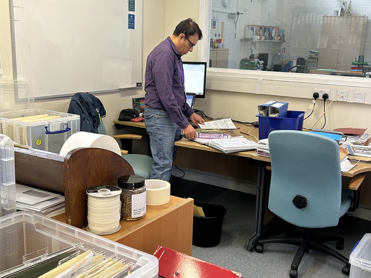 A man working through archiving the Alan Walker Collection at The Hockey Museum