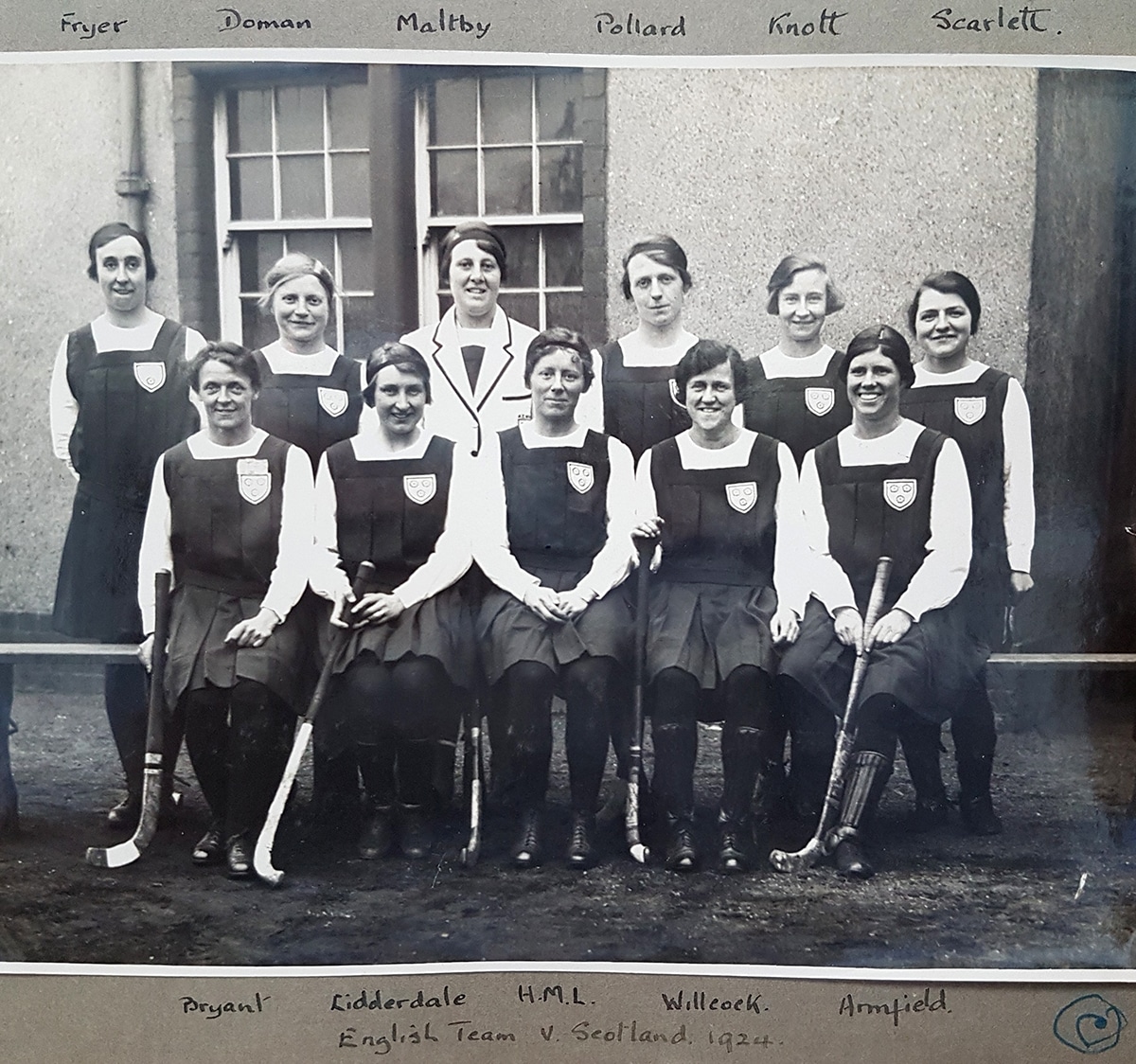 A black and white image of a women's hockey team