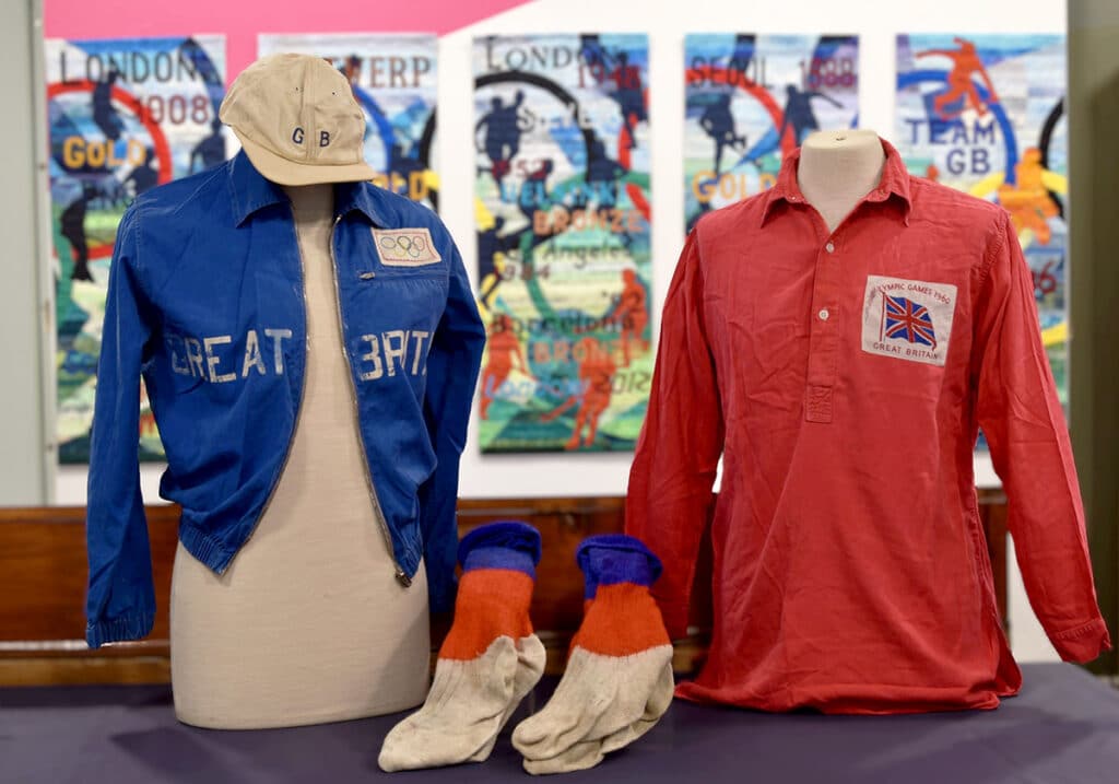 An image of the Great Britain hockey playing shirt and socks, and recreational jacket and cap of Dr John Bell.