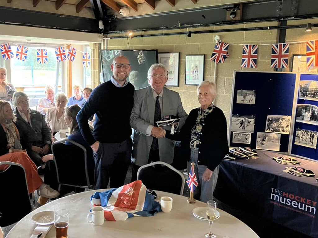 an image of John Neill's GB honours cap which is being presented to his widow Cecilia Neill and their son Johnny by THM President and Hon. Curator Mike Smith during a presentation at Southgate Hockey Club. 