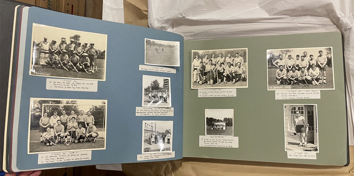 A colour image of a a photograph album containing many photos documenting the Puritans tour to Le Toquet festival.