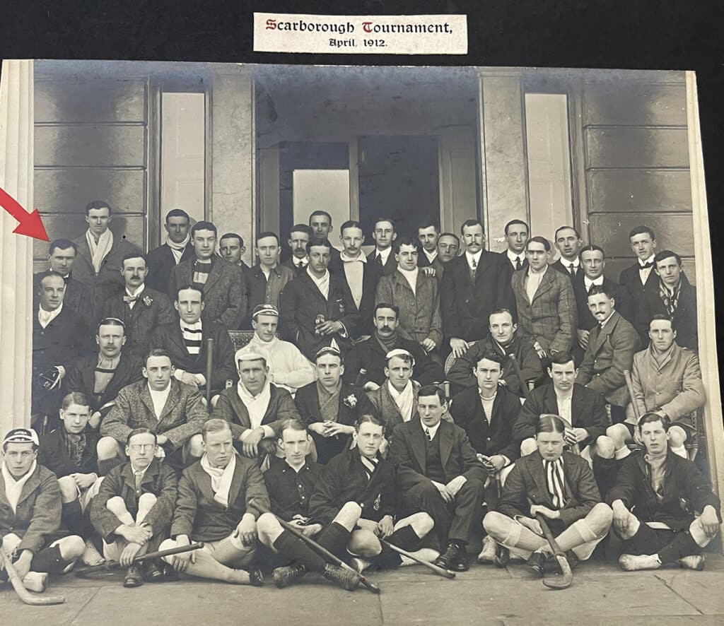 A black and white group photograph from the Scarborough Festival. All male players in blazers, caps and suit jackets, many holding hockey sticks.