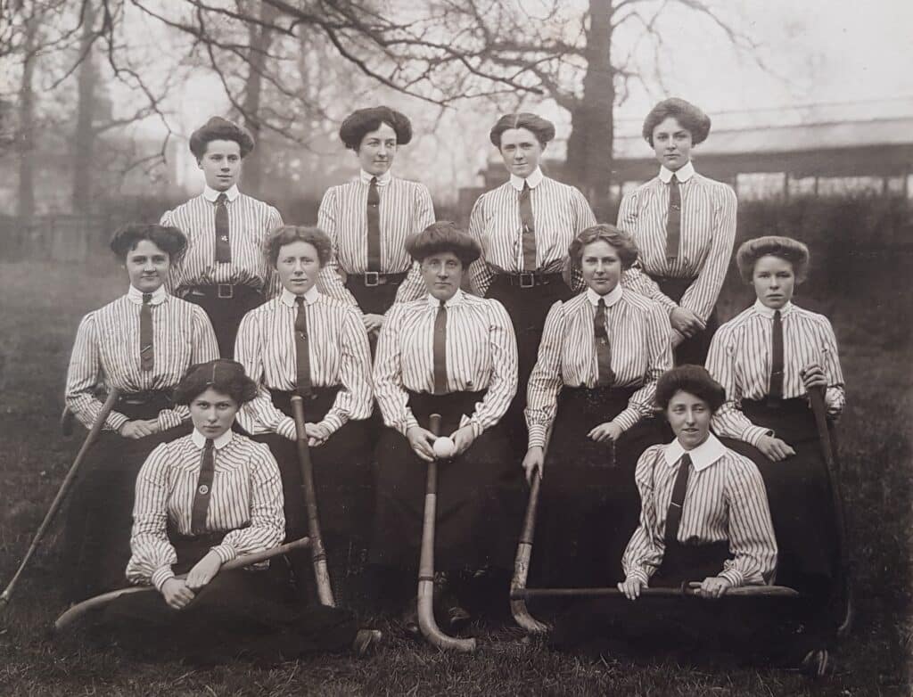 A black and white photo of a women's hockey team