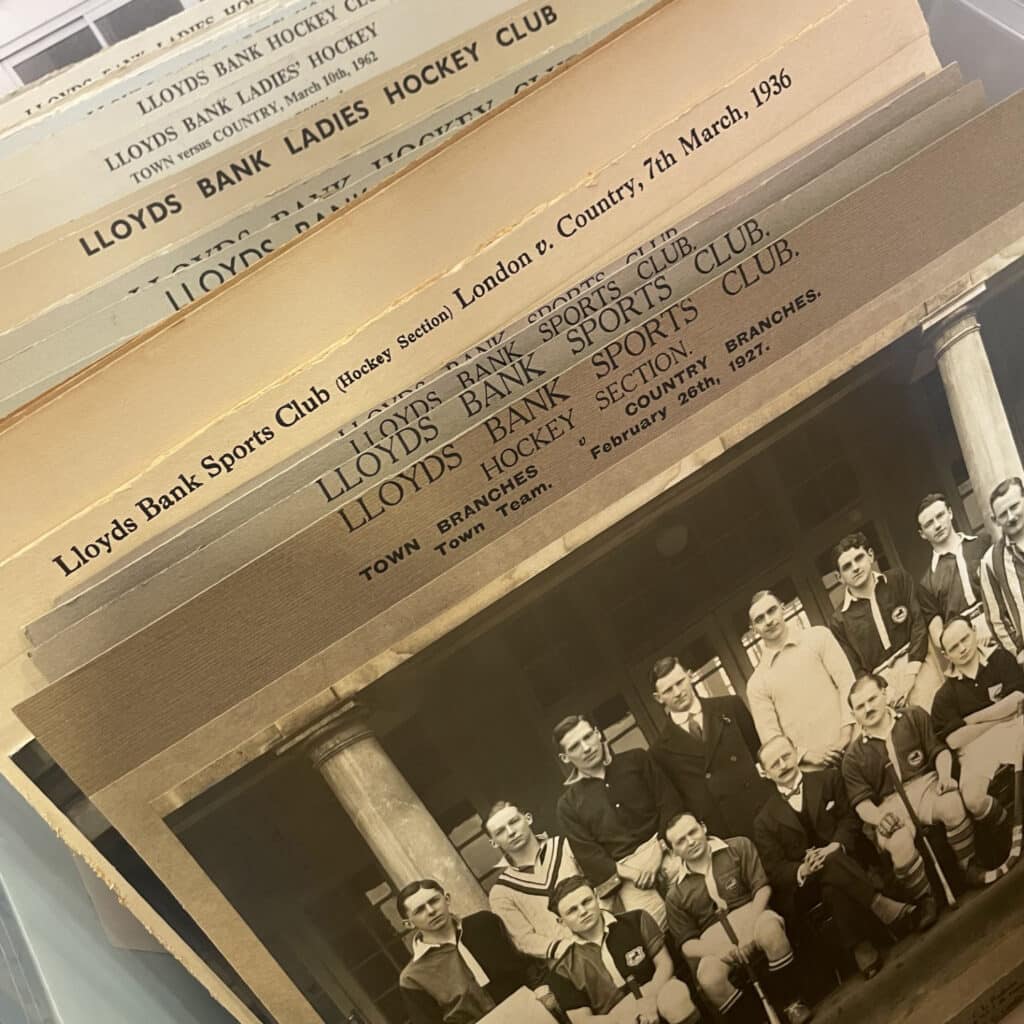 An image showing a variety of printed documents including a black-and-white picture of a men's hockey team