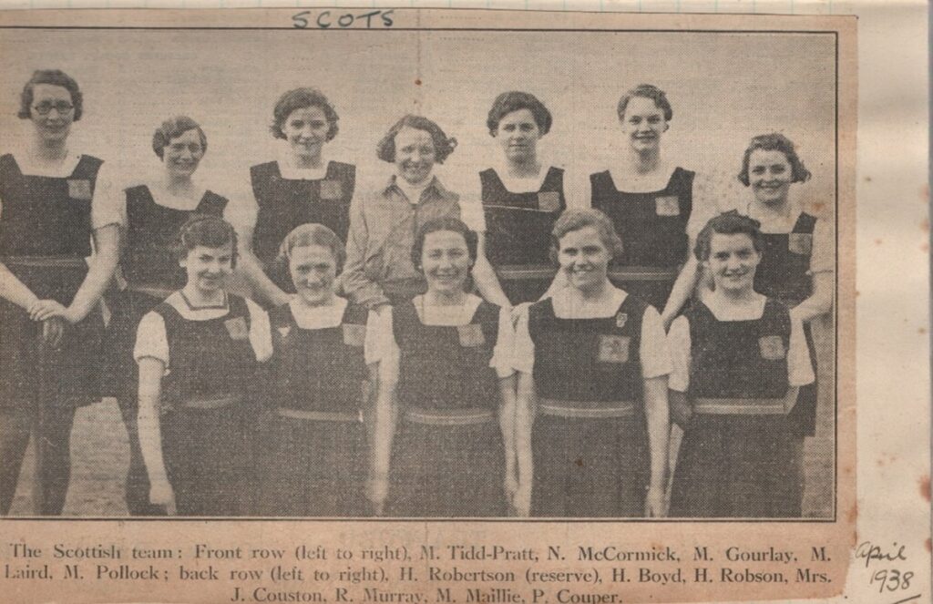 A black and white image of a women's hockey team