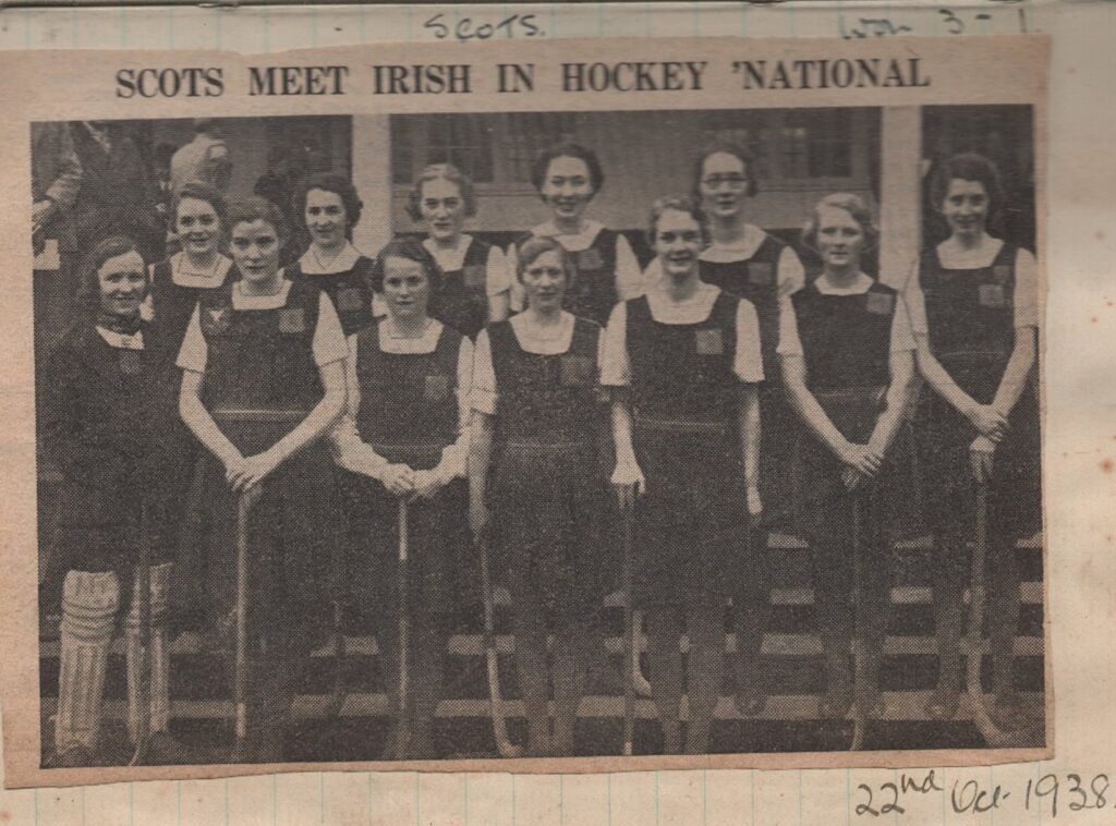 A black and white photo of a women's hockey team