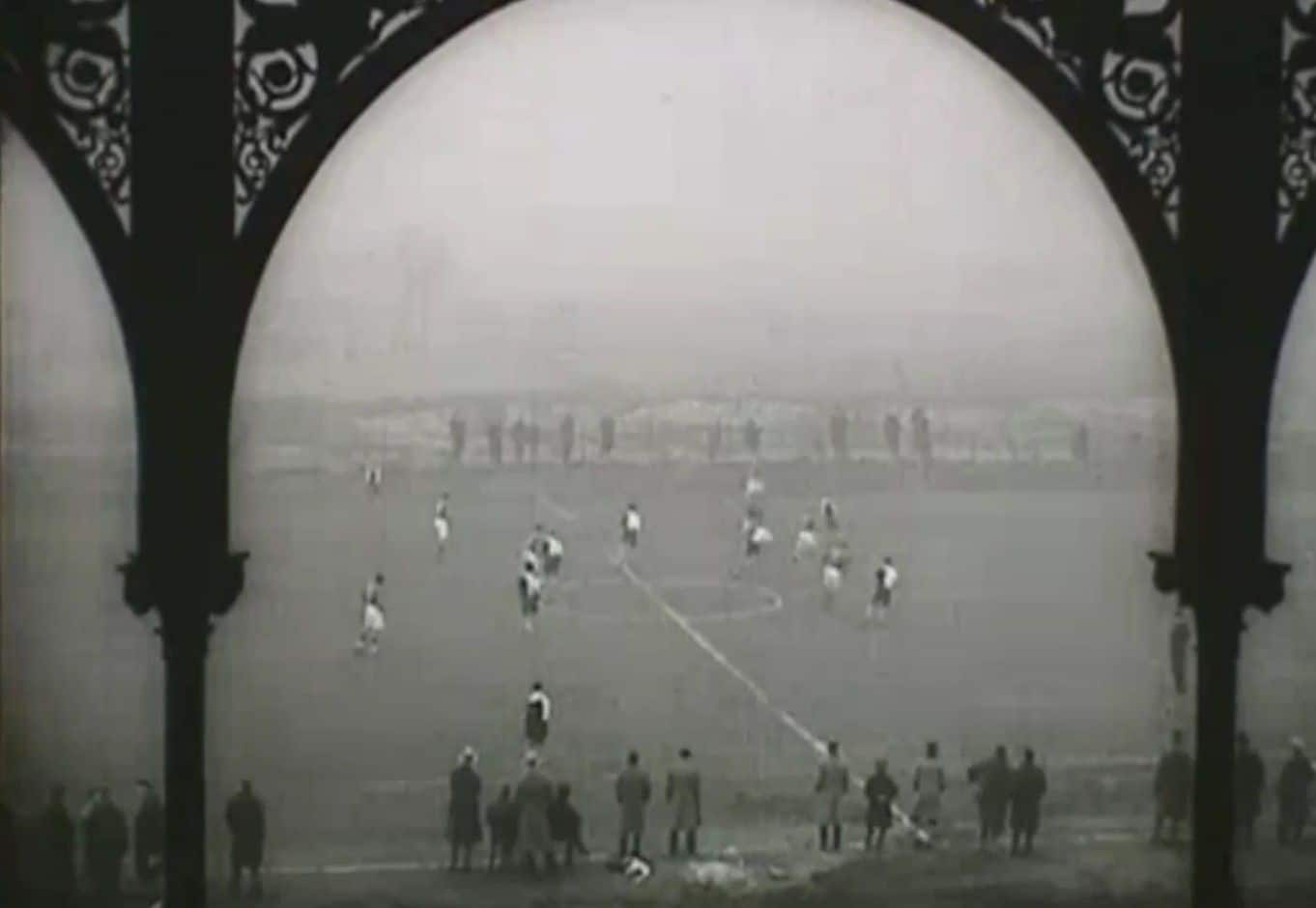 A black and white still from a cinefilm of a hockey match