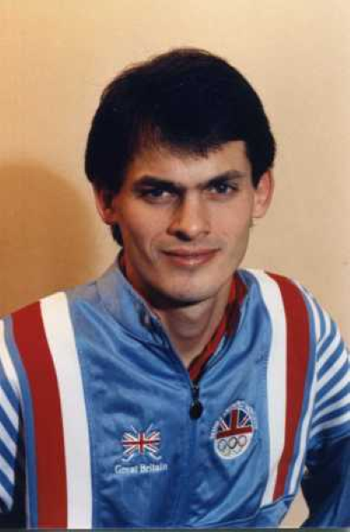 A colour image of a man looking at the camera in a Great Britain tracksuit top