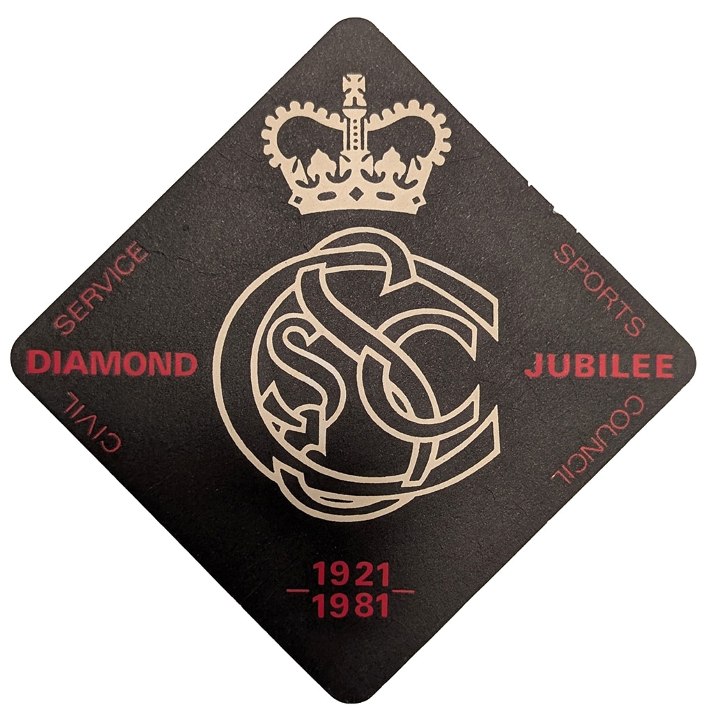 Civil Service Coaster A black diamond drinks mat with red text and a central logo made up of entwined letters C and S with a crown above it.