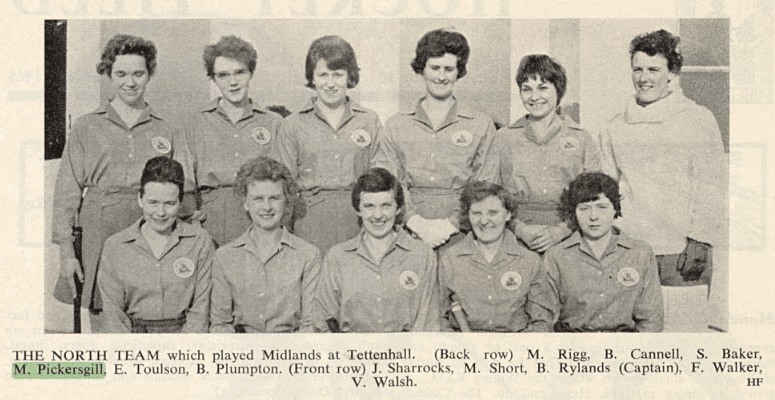 Black and white photograph of young women in two rows wearing button-up playing shirts