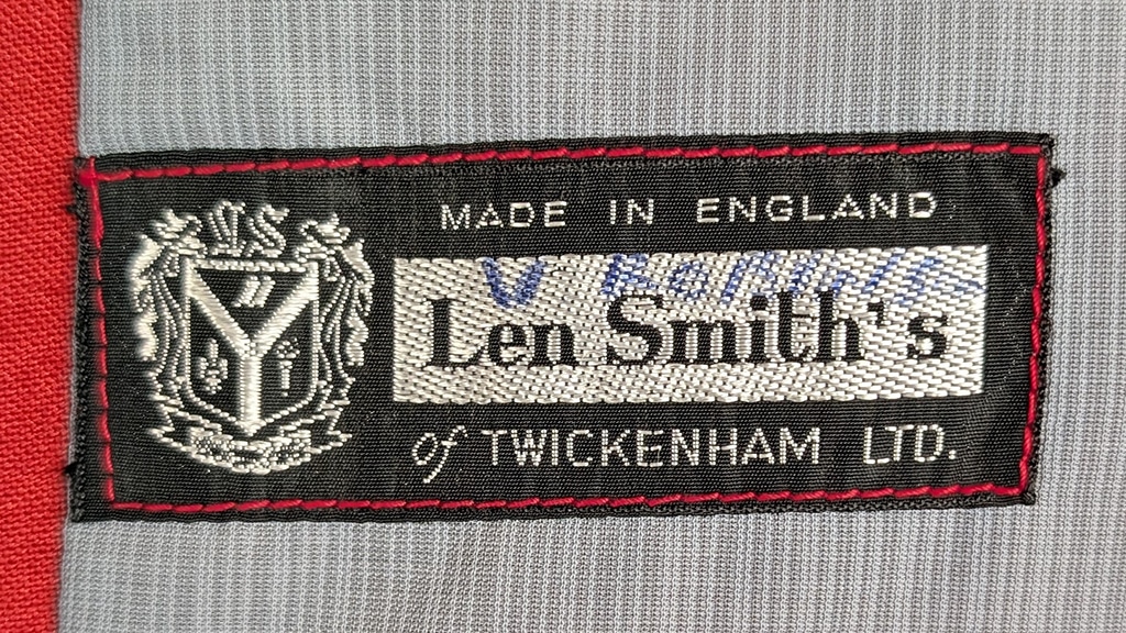 Detail of a fabric label bearing the name Len Smith's