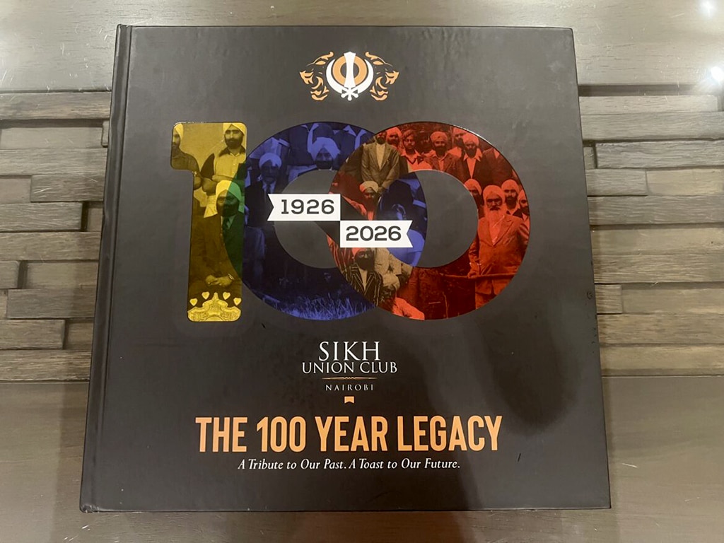 A large black hardback book with shiny golden lettering.