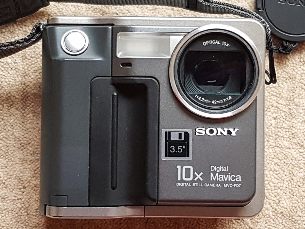 A square-shaped, grey and silver-coloured early digital camera.